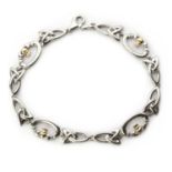 A silver and gold bracelet, by Solvar,