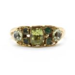 A gold Victorian chrysolite and emerald ring