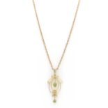 An Edwardian gold peridot and split pearl pendant,