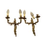 A pair of gilt-metal twin-branch wall lights