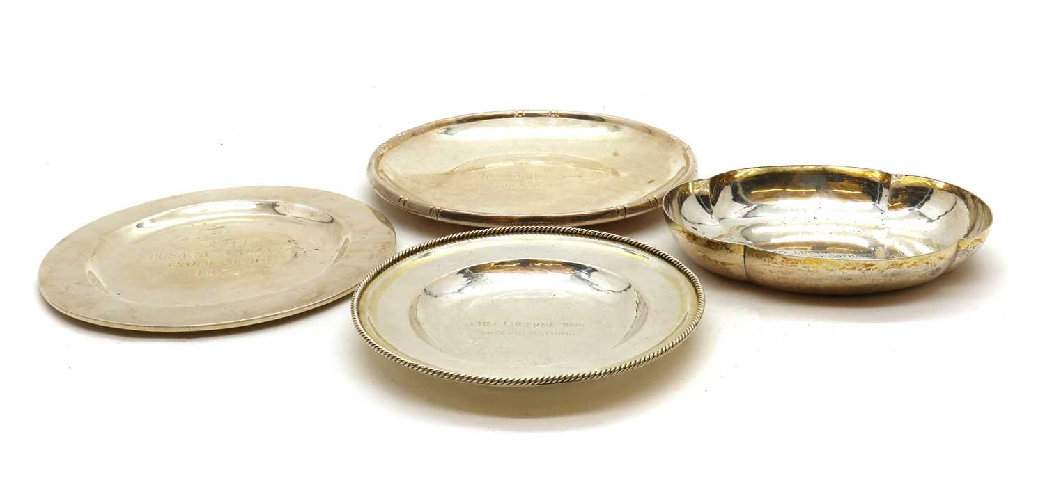 A collection of silver presentation dishes,