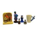 A collection of Clarice Cliff figural items,