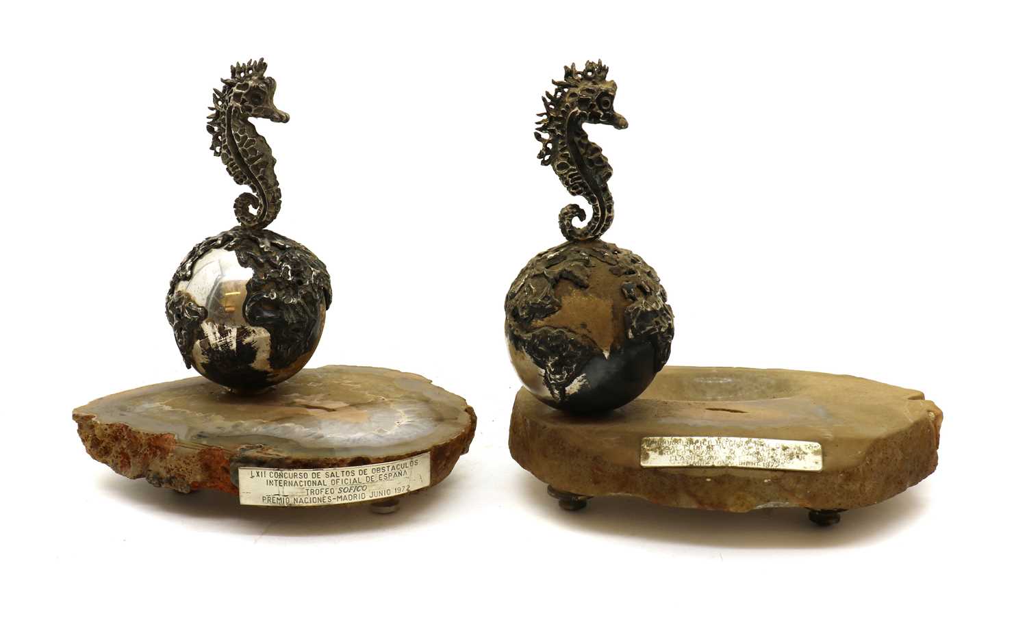 A pair of silver plated trophies