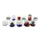 A collection of glass paperweights