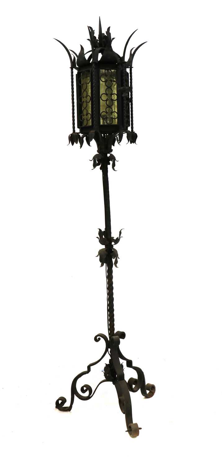 An Arts and Crafts wrought iron standard lamp,
