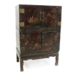 A lacquered Chinese three-part cabinet