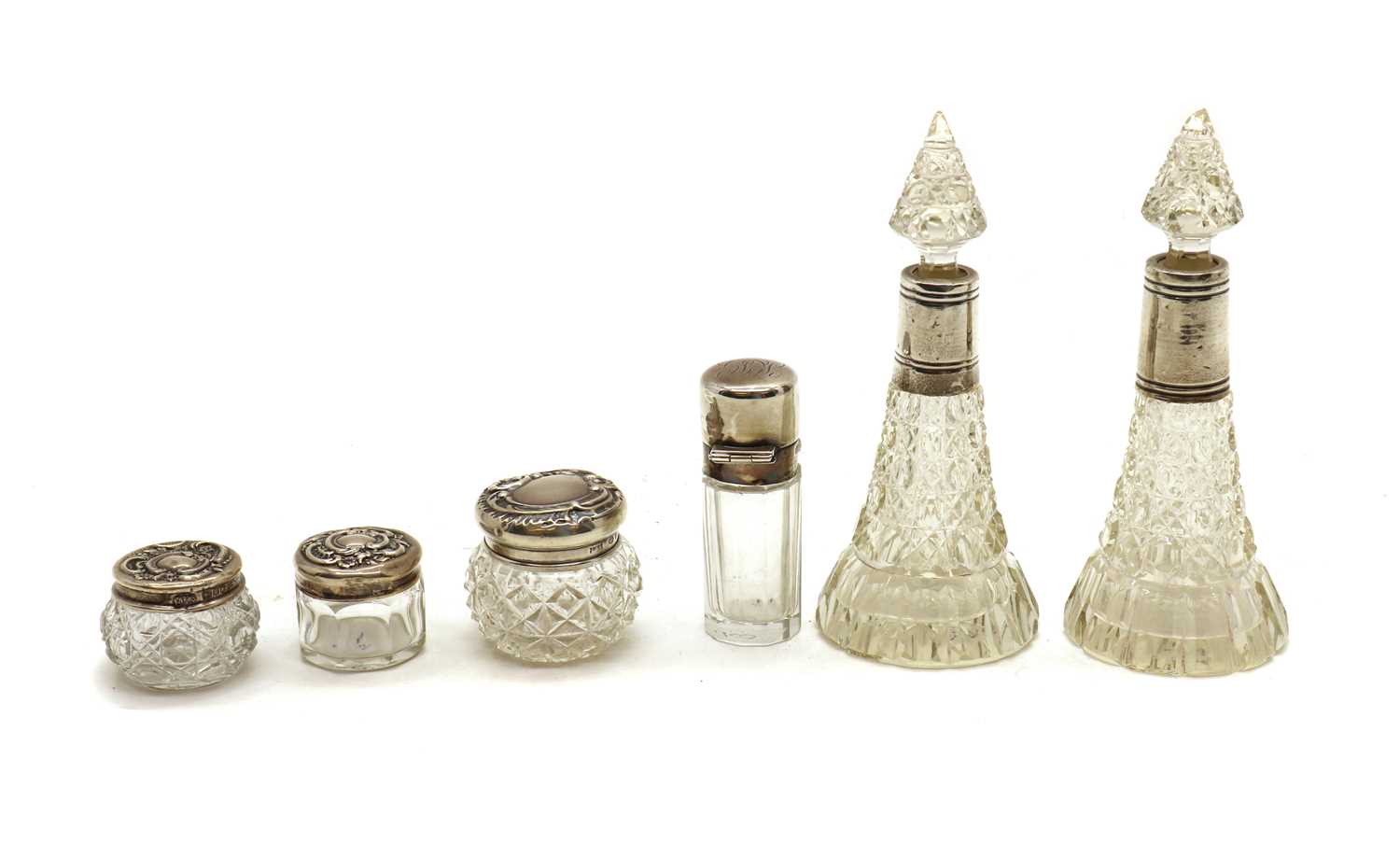 A collection of silver mounted cut glass dressing table bottles