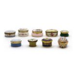 A collection of enamel pillboxes,