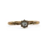 A gold single stone diamond ring,