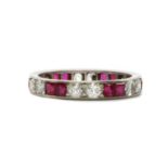 A synthetic ruby and diamond full eternity ring,