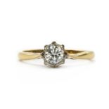 A gold single stone diamond ring,