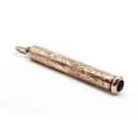 A gold propelling combination pencil/pen,