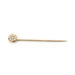 A gold diamond and split pearl stick pin,