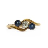 An Edwardian 18ct gold diamond and sapphire three stone ring,