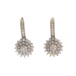 A pair of gold diamond cluster drop earrings,