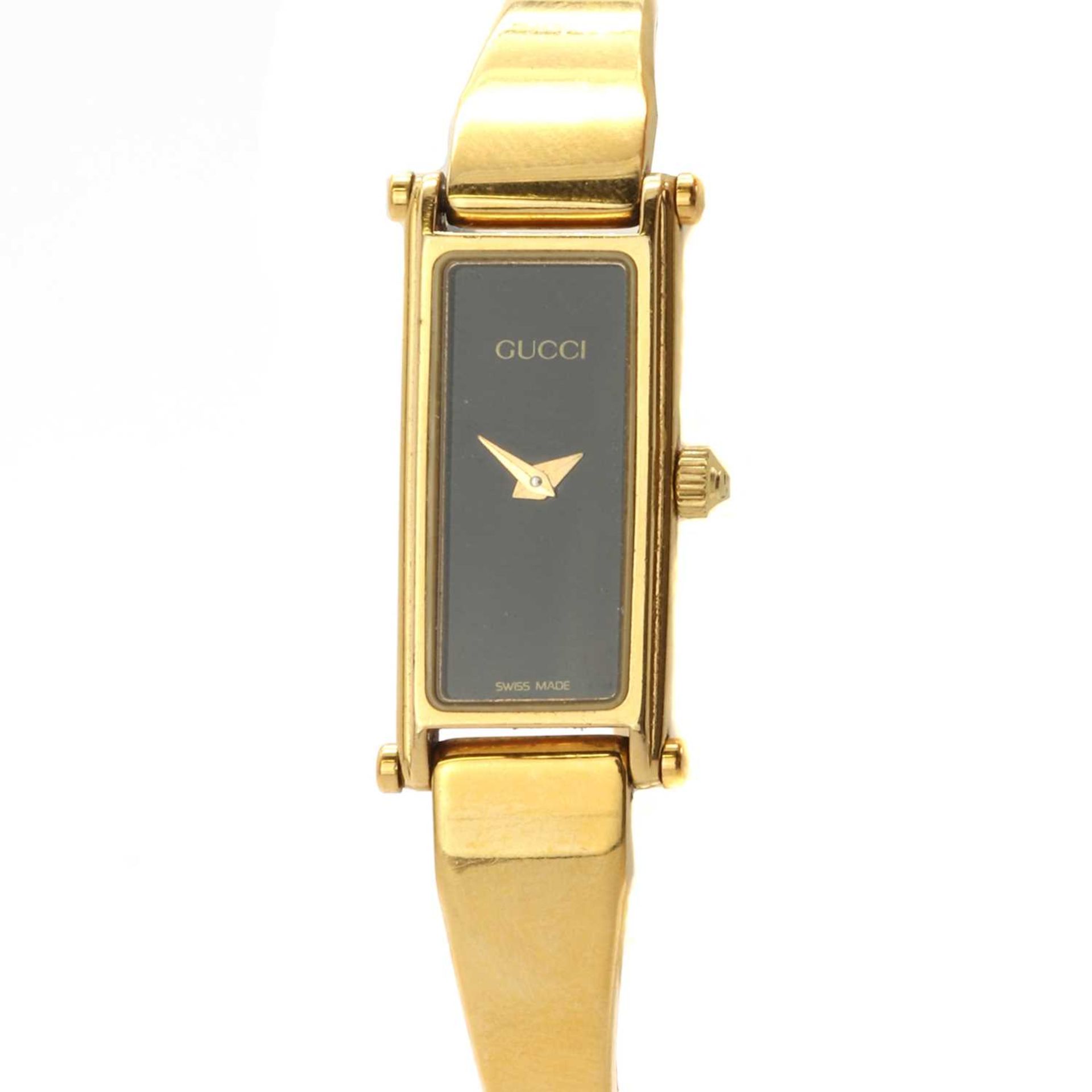 A ladies' gold plated Gucci quartz bangle watch,
