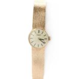 A ladies' 9ct gold Tissot mechanical bracelet watch,