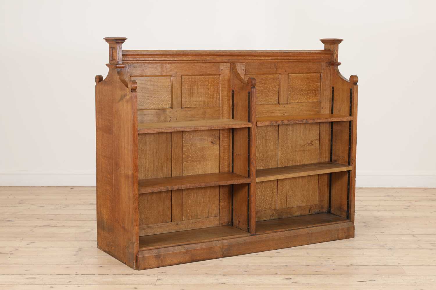 An oak double-sided bookcase,