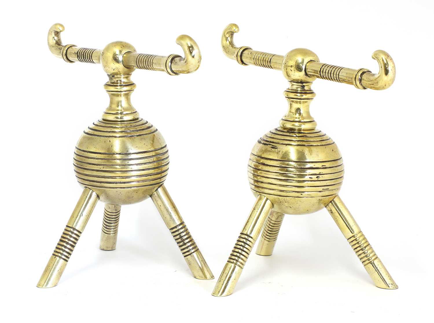 A pair of brass firedogs,