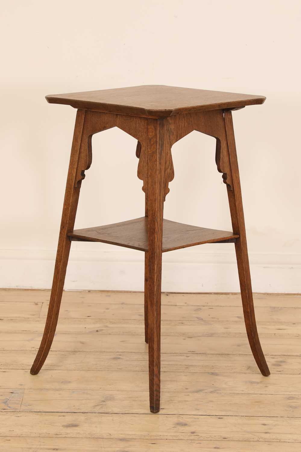 A Liberty-style oak lamp table,