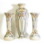 A matched garniture of three Arnhem pottery vases,