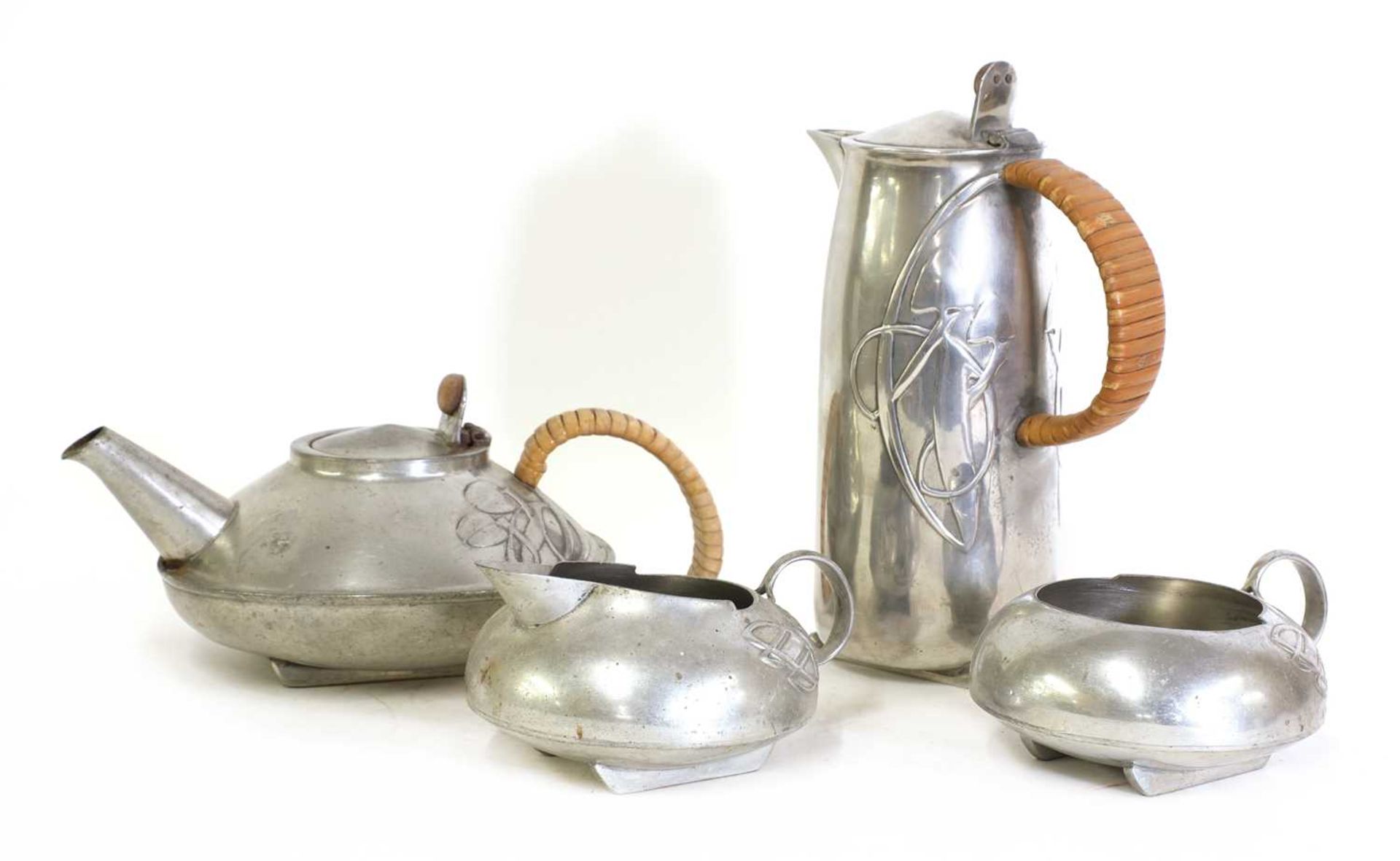 A matched 'Tudric' pewter three-piece tea set,