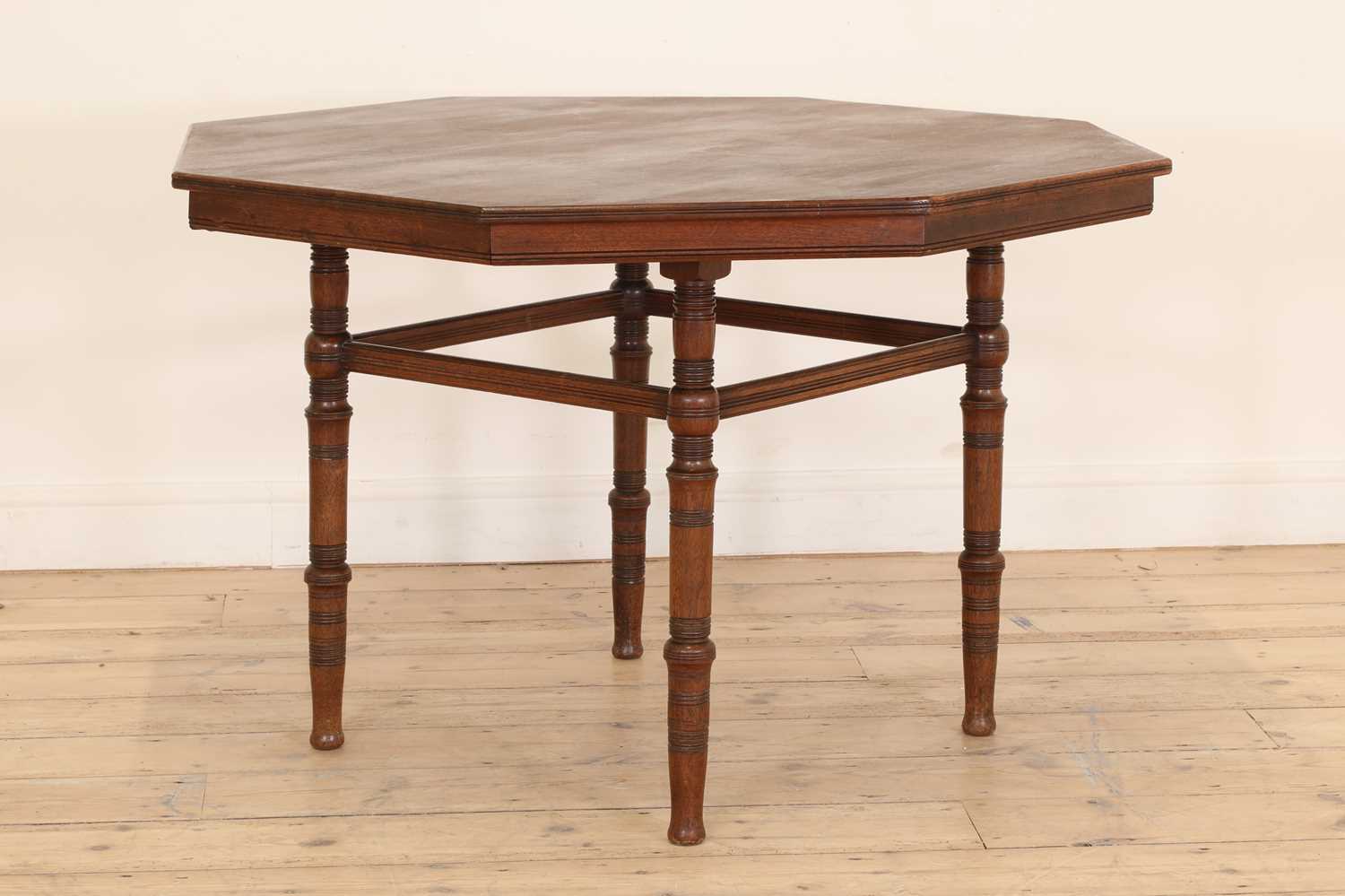 An Aesthetic walnut centre table,