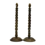 A pair of brass barley twist candlesticks