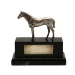 A silver trophy of racing horse interest