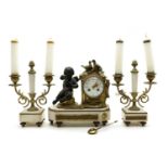 A French gilt metal and white marble clock garniture