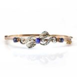 A late Victorian sapphire and diamond hinged bangle,