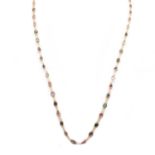 A gold varicoloured spinel rivière necklace,