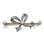 A late Victorian diamond set bow bar brooch, c.1890,