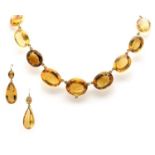 A Victorian graduated citrine matched demi parure,