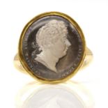A George IV gold, glass cameo sulphide ring, by Rundell, Bridge & Rundell, c.1815,