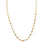 A gold varicoloured sapphire rivière necklace,