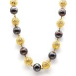 An 18ct gold filigree style bead and ironstone bead necklace, c.1990,