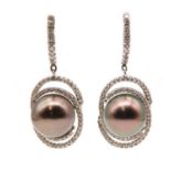 A pair of Continental Tahitian cultured pearl and diamond drop earrings,