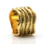 A wavy gold 'sleeve' ring designed by K R Hooper of Hooper Bolton Ltd., c.1973, and made by Leo De V