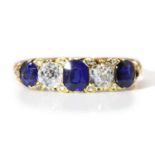 An 18ct gold late Victorian sapphire and diamond carved head ring,
