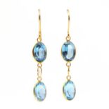 A pair of gold blue topaz drop earrings,