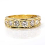 An 18ct gold diamond set half eternity ring, c.1970,