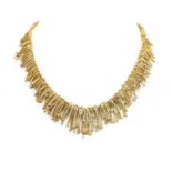 A two colour gold diamond set fringe necklace, by Wellendorf, c.1980,