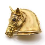 An 18ct gold horsehead brooch, by Harriet Glen,