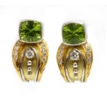 A pair of 18ct two colour gold peridot and diamond earrings,