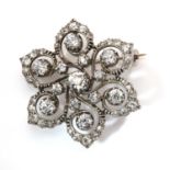 A Victorian diamond set flower head brooch/pendant, c.1890,