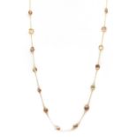 A gold zircon set chain,