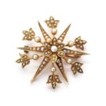 An Edwardian gold split pearl star brooch/pendant,