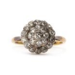 An early 20th century gold three row diamond cluster ring,