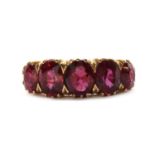 A gold five stone ruby ring, c.1910,